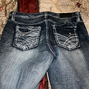 Dark, denim blue jeans with rips. Nice fit and true to size.